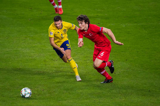 Marcus Berg of Sweden and Caglar Söyuncu of Turkey
