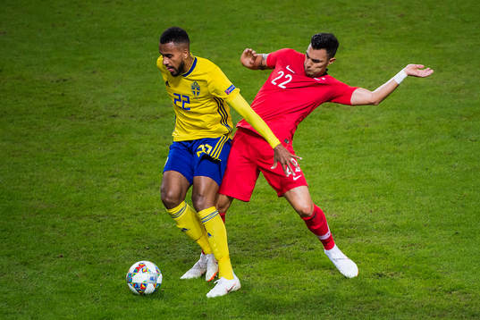 Isaac Kiese Thelin of Sweden and Kaan Ayhan of Turkey