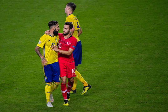 Jimmy Durmaz of Sweden and Hakan Calhanoglu of Turkey