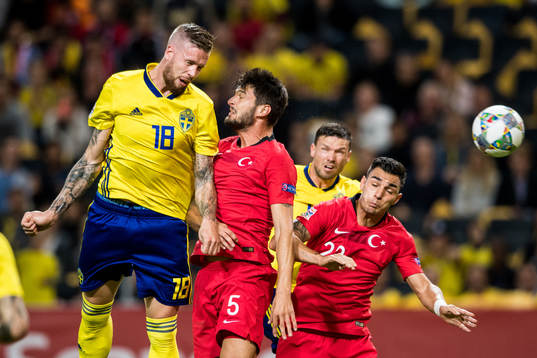 Pontus Jansson and Marcus Berg of Sweden in action with