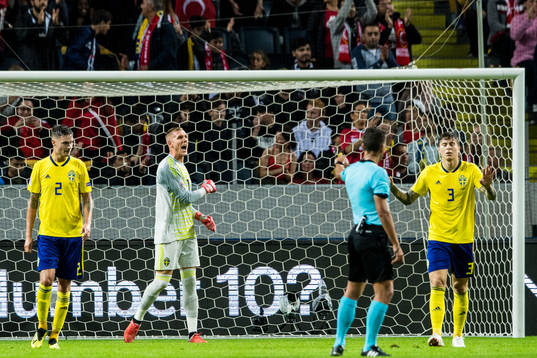 Mikael Lustig, goalkeeper Robin Olsen and Victor Nilsson