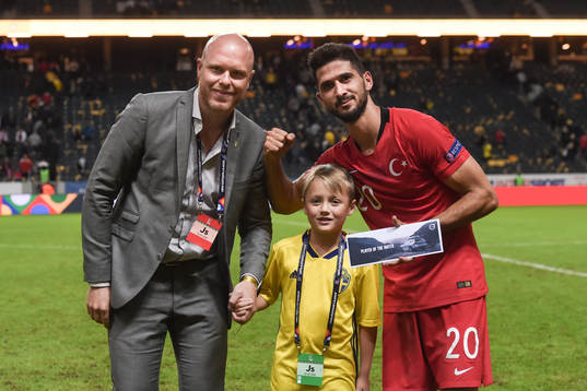 Emre Akbaba of Turkey is awarded the man of the match