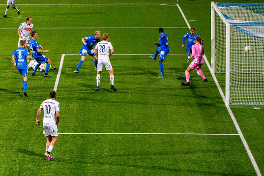 Axel Andresson of Viking (partly hidden) scores 1-2 behind