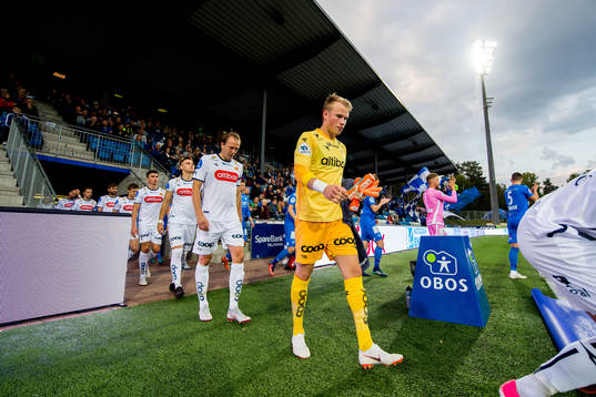 Goalkeeper Amund Wichne of Viking enters the pitch