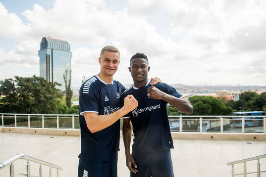 Goalkeeper Aleksandr Vasyutin and Muhammed Usman Edu of