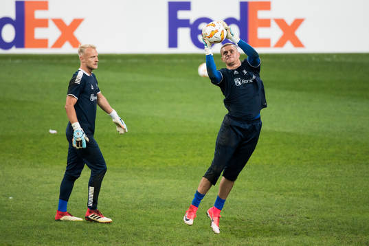 Goalkeeper Aslak Falch and goalkeeper Aleksandr Vasyutin of