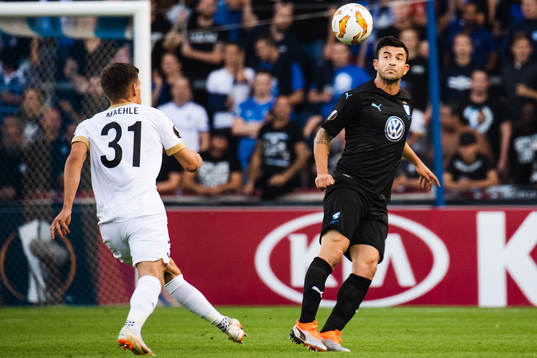 Joakim Maehle of Genk and Behrang Safari of Malmö FF