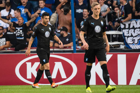 Behrang Safari and Sören Rieks of Malmö FF looks dejected
