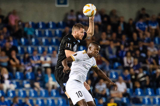 Lasse Nielsen of Malmö FF and Mbwana Samatta of Genk