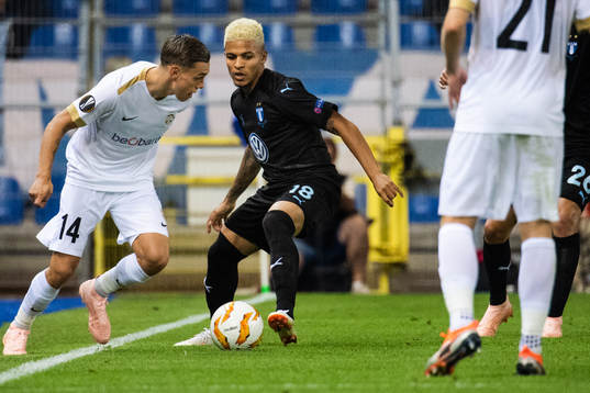 Leandro Trossard of Genk and Romain Gall of Malmö FF