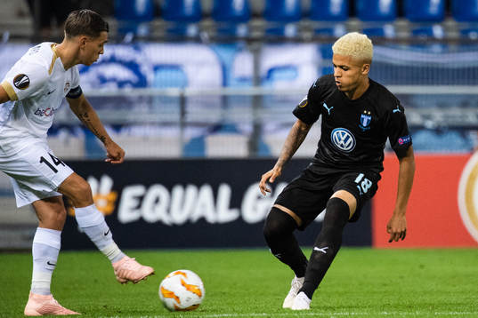Leandro Trossard of Genk and Romain Gall of Malmö FF