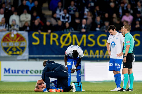Erling Braut Håland of Molde lies down with an injury