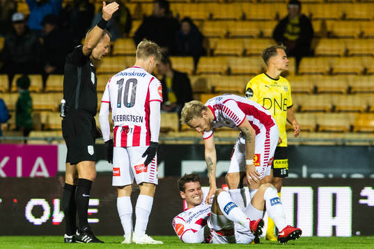 Simen Wangberg of Tromsø lies down injured