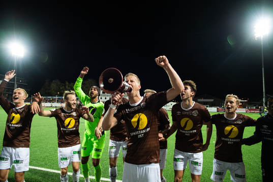 Joackim Solberg of Mjøndalen celebrates with team mates