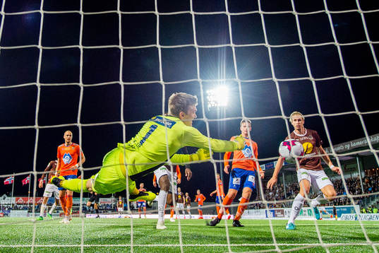 Quint Jansen of Mjøndalen scores 2-0 behind goalkeeper