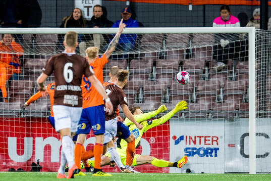 Tonny Brochmann of Mjøndalen scores 1-0 behind goalkeeper