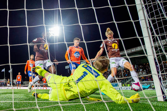 Quint Jansen of Mjøndalen scores 2-0 behind goalkeeper