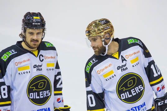 Kristian Forsberg and Jacob Lagacé of Stavanger Oilers
