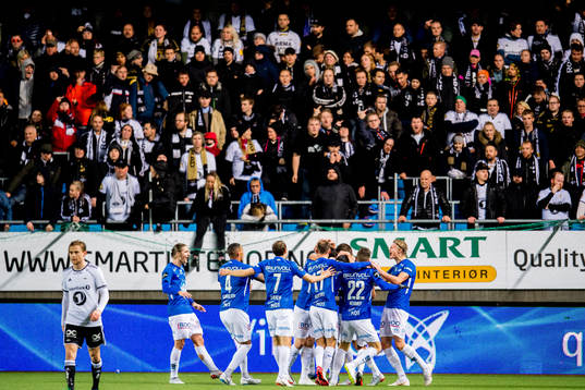 Vegard Forren of Molde (hidden) celebrates with teammates