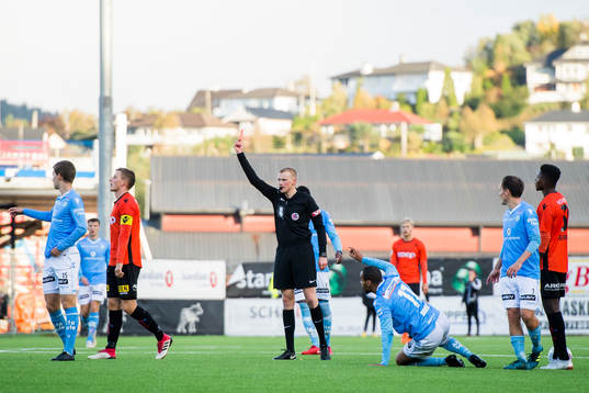 Jonas Hestetun of Åsane is shown a red card by referee