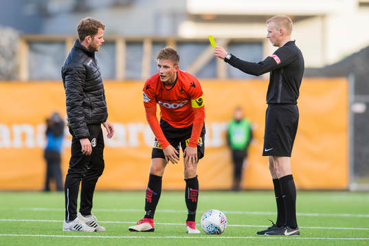 Jonas Hestetun of Åsane is shown a yellow card by referee