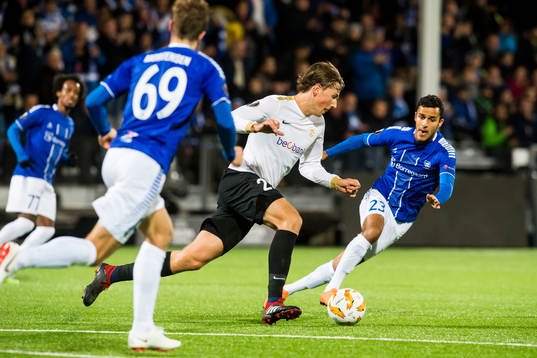 Sander Berge of Genk and Harmet Singh of Sarpsborg 08