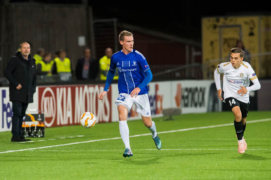 Jon-Helge Tveita of Sarpsborg 08 and Leandro Trossard of
