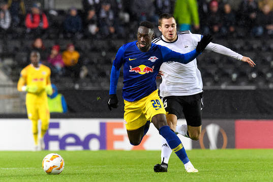 Jean-Kevin Augustin of RB Leipzig and Djordje Denic of