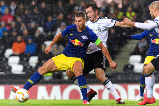 Willi Orban of RB Leipzig and Even Hovland of Rosenborg