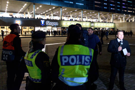 Police and spectators outside the stadium
