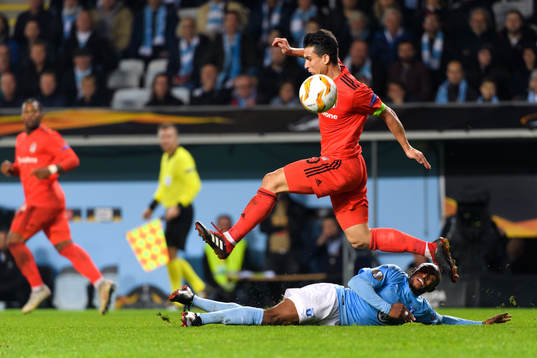 Necip Uysal of Besiktas and Fouad Bachirou of Malmö FF