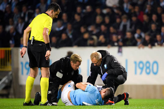 Behrang Safari of Malmö FF recives medical attention