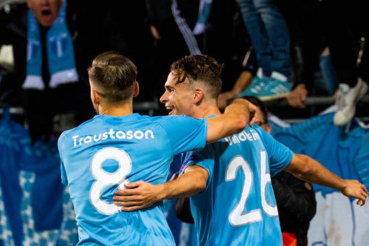 Arnór Ingvi Traustason celebrates with Andreas Vindheim of