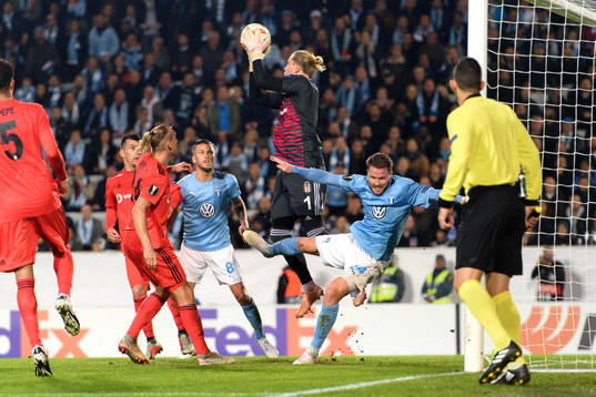 Lasse Nielsen of Malmö FF and Goalkeeper Loris Karius of