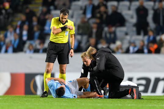 Behrang Safari of Malmö FF recives medical attention