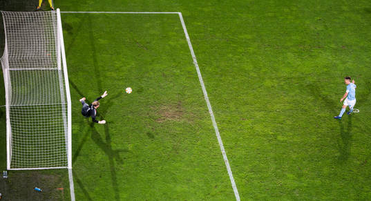 Markus Rosenberg of Malmö FF scores the 2-0 goal from the