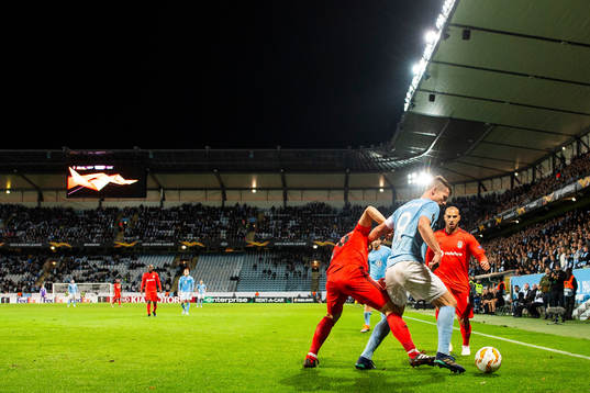 Markus Rosenberg of Malmö FF in action with Necip Uysal of