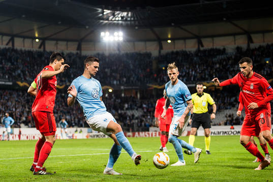 Marcus Antonsson of Malmö FF and Necip Uysal of Besiktas