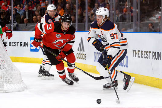 Nico Hischier of the New Jersey Devils and Connor McDavid
