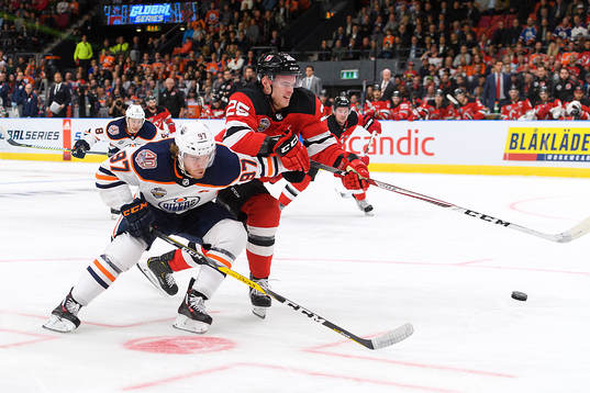 Connor McDavid of the Edmonton Oilers and Mirco Mueller of