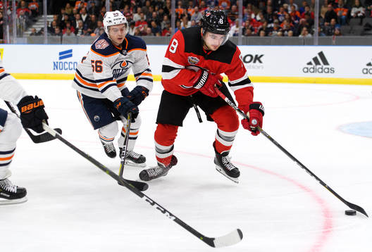 Kailer Yamamoto of the Edmonton Oilers and Will Butcher of