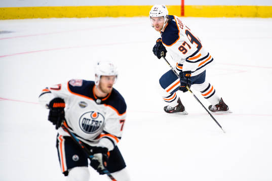 Oscar Klefbom and Connor McDavid of the Edmonton Oilers