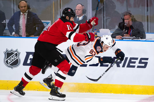 Brian Boyle of the New Jersey Devils and Matt Benning of