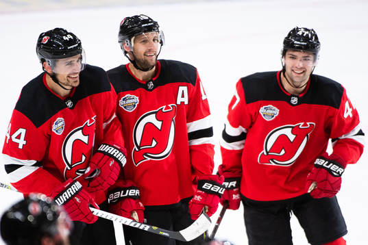 Miles Wood and John Quenneville of the New Jersey Devils