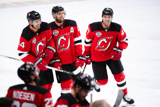 Miles Wood and John Quenneville of the New Jersey Devils