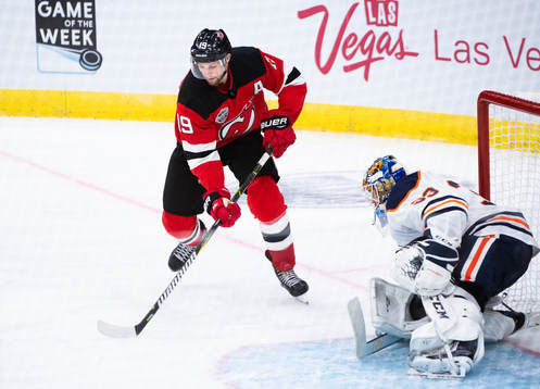 Travis Zajac of the New Jersey Devils against Cam Talbot of