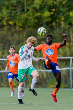 Peder Nersveen of HamKam and Pape Habib Gueye of Aalesund