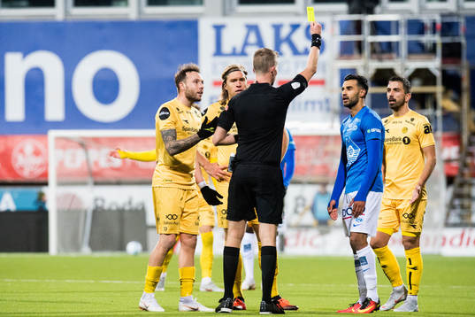 Etzaz Hussain of Molde is shown a yellow card bye the
