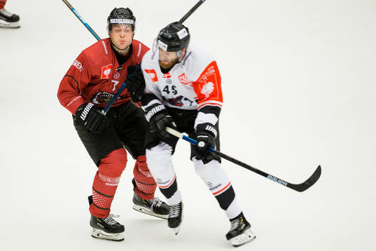 Mikkel Höjbjerg of Aalborg hits Pathrik Westerholm of