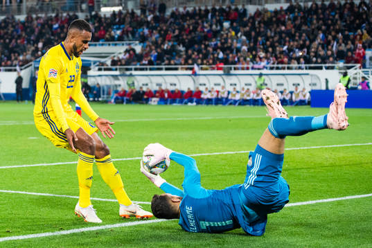 Isaac Kiese Thelin of Sweden and goalkeeper Guilherme of